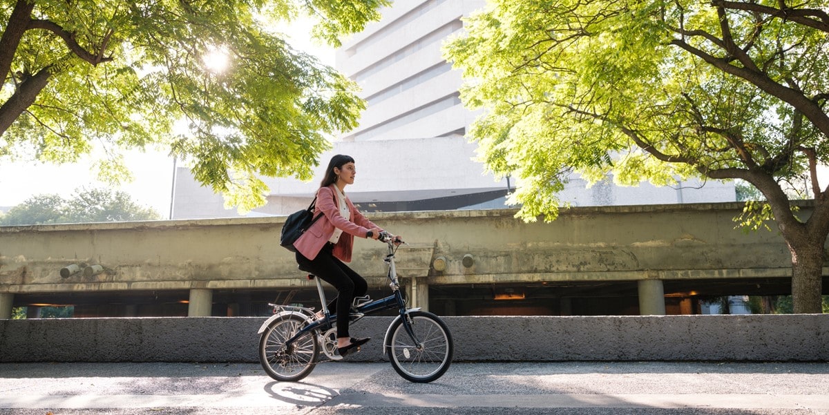 woman riding a bicycle in city