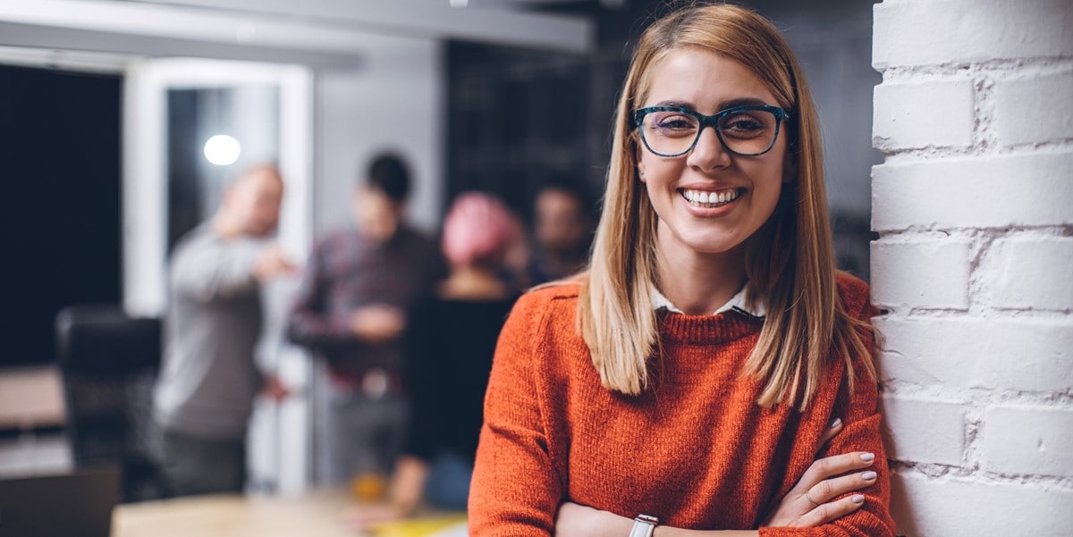 professional woman smiling, in the office