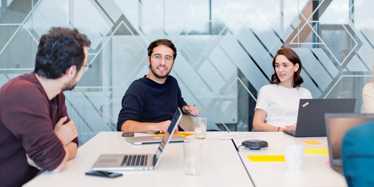 group of professionals meeting in the office, at a conference table
