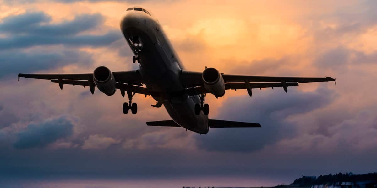 flight plane in the sky with travel managers and travellers