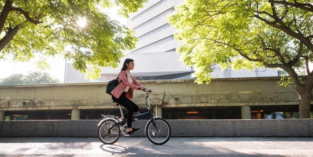woman riding a bicycle in city