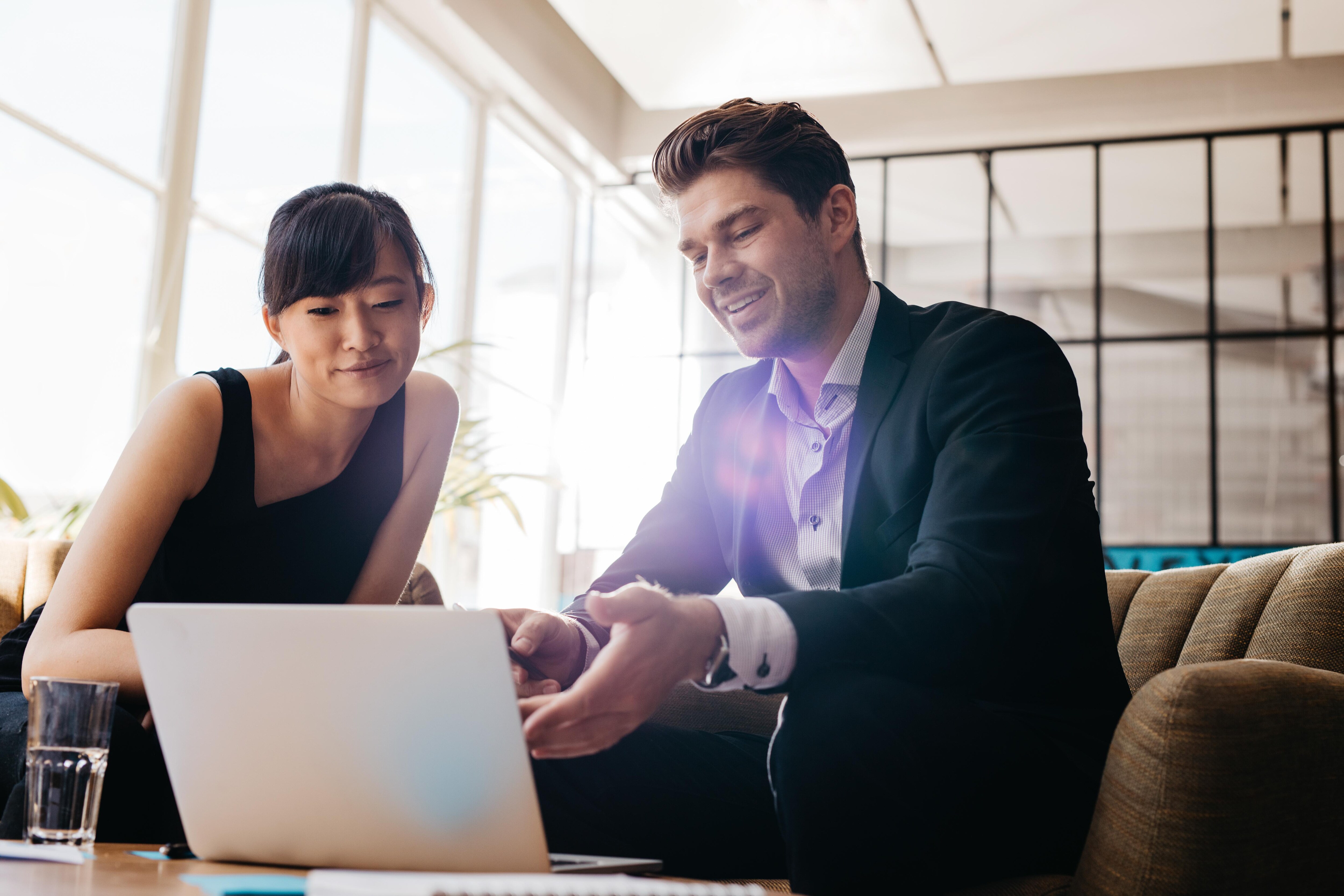 two happy workers in a meeting