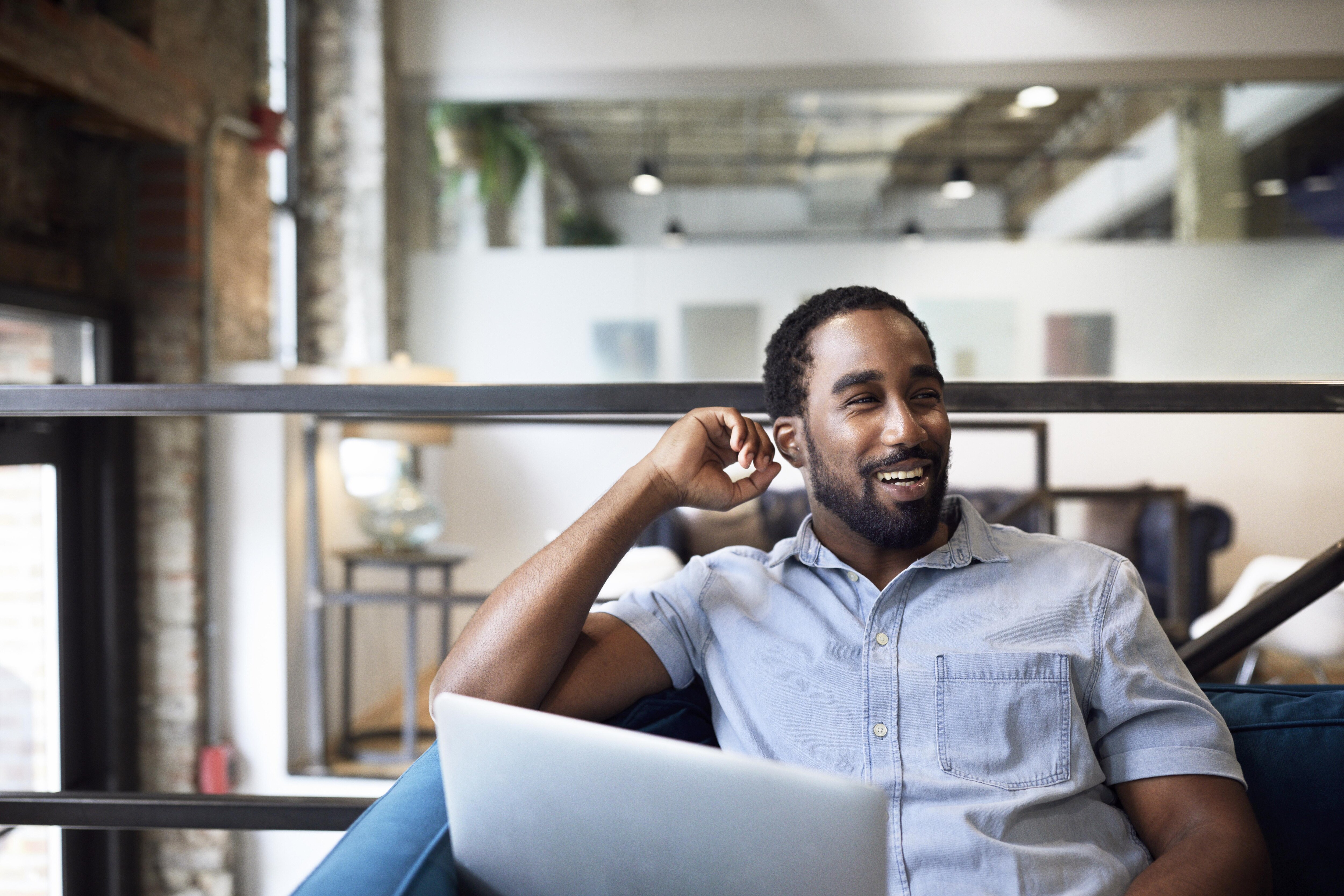 happy worker at laptop